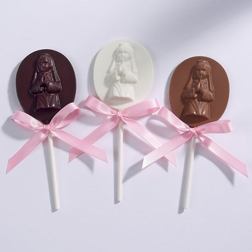 Chocolate pops for communion featuring a young girl praying