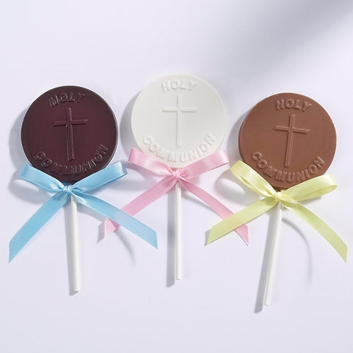 Chocolate pops shaped like a medallion with a cross in the center and the text "Holy Communion"