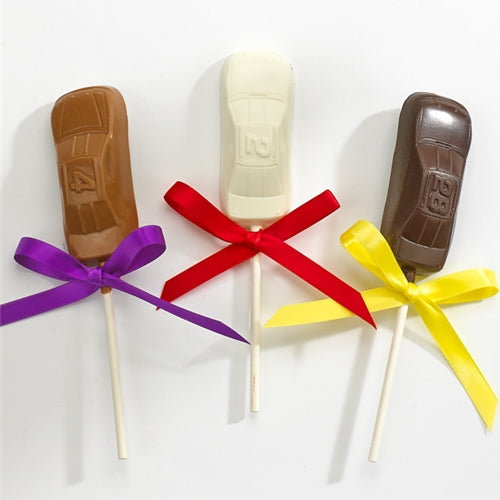 Three chocolate lollipops shaped like race cars